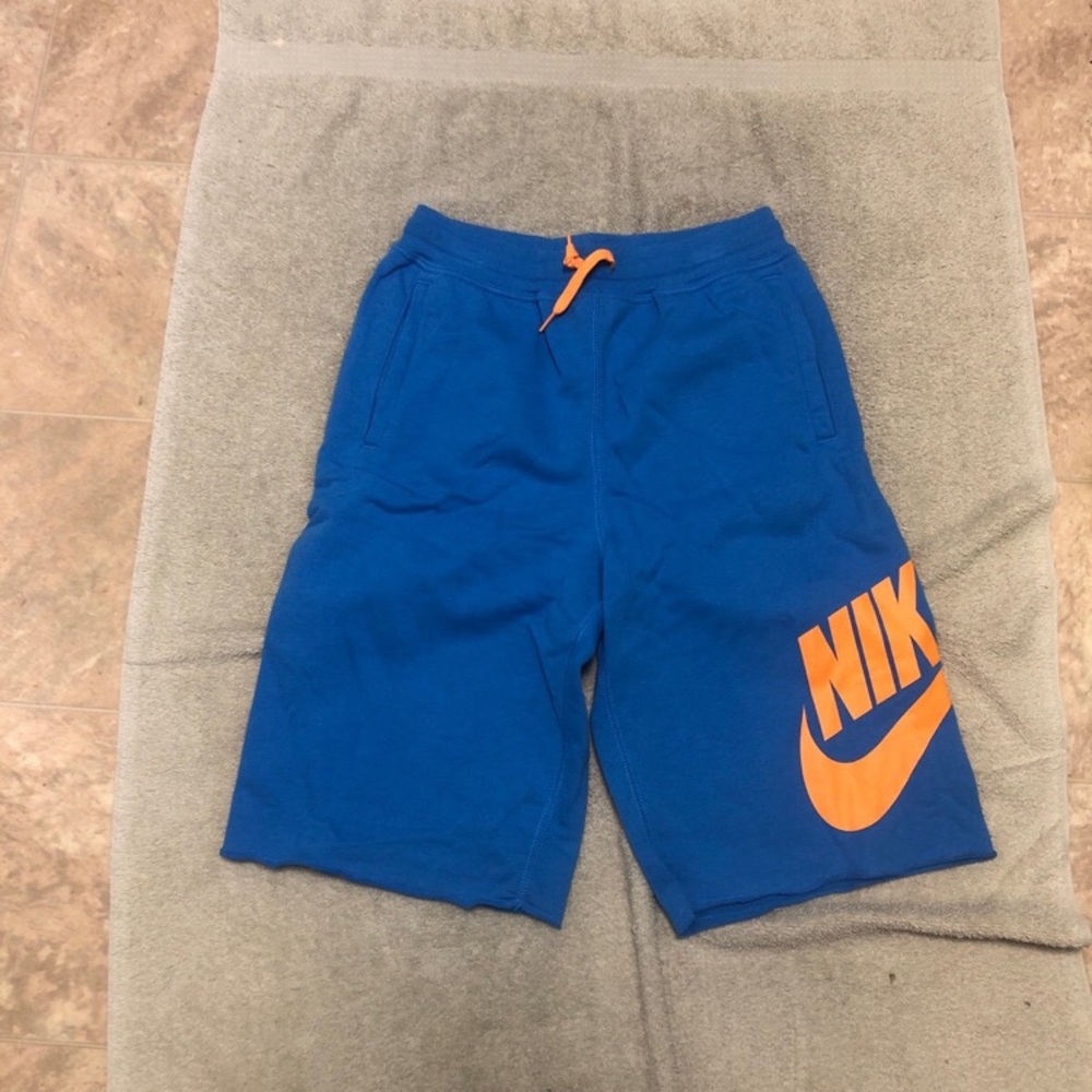 Nike Kids Vibrant Blue Shorts with Bold Orange Accents